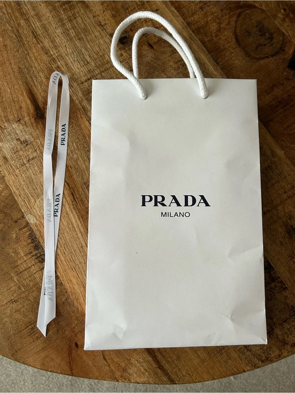 Prada Black Leather Card Holder with Gold Crest